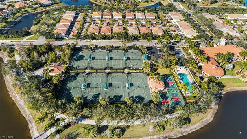 Aerial overview of property's location with a large body of water and nearby suburban area