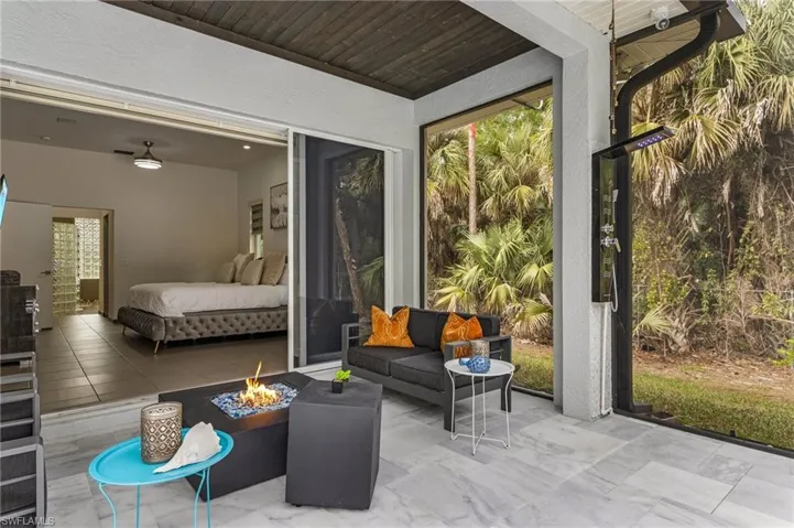 Sunroom featuring wooden ceiling