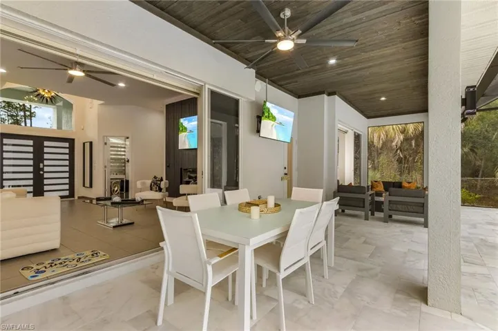 Dining room with ceiling fan and wood ceiling