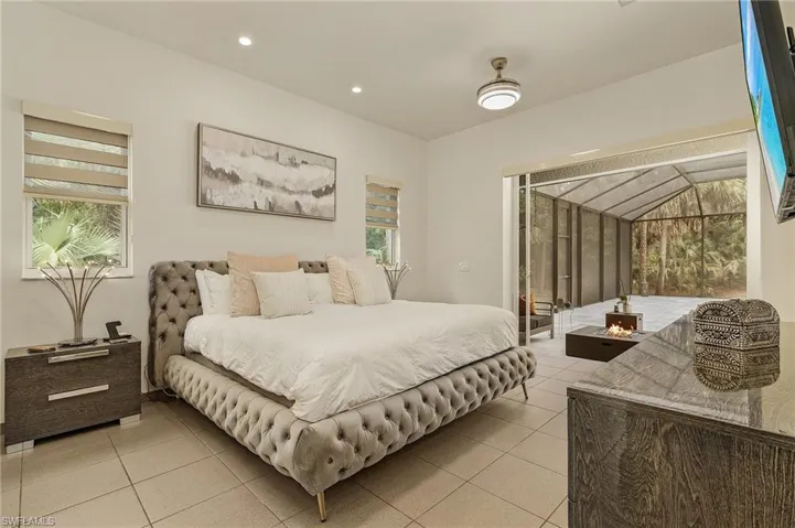 Tiled bedroom with access to exterior