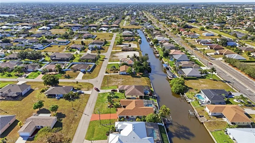 Aerial view of property's location featuring nearby suburban area