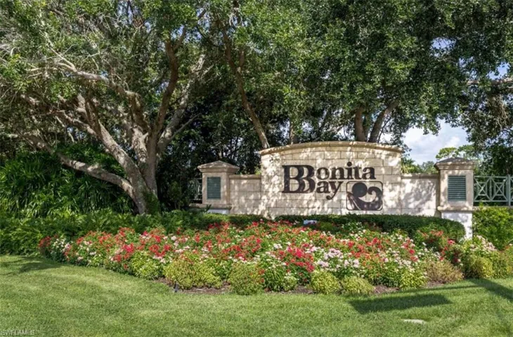 Community / neighborhood sign with a lawn