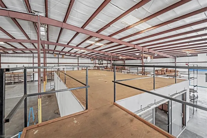 Expansive interior with exposed metal beam construction and high ceilings