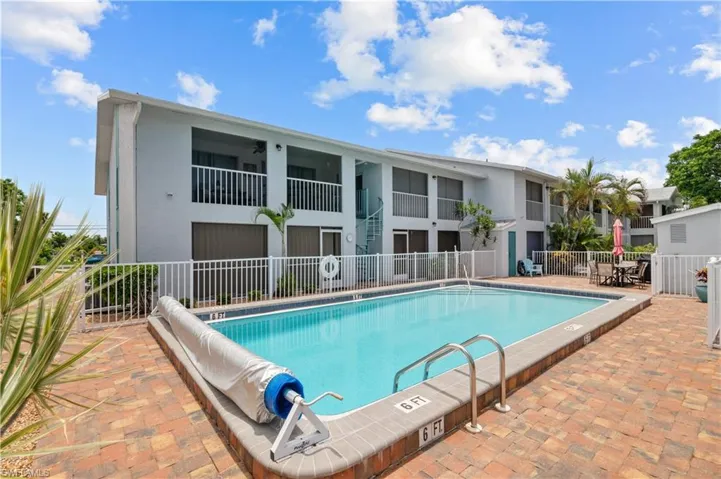 Community pool featuring a patio area