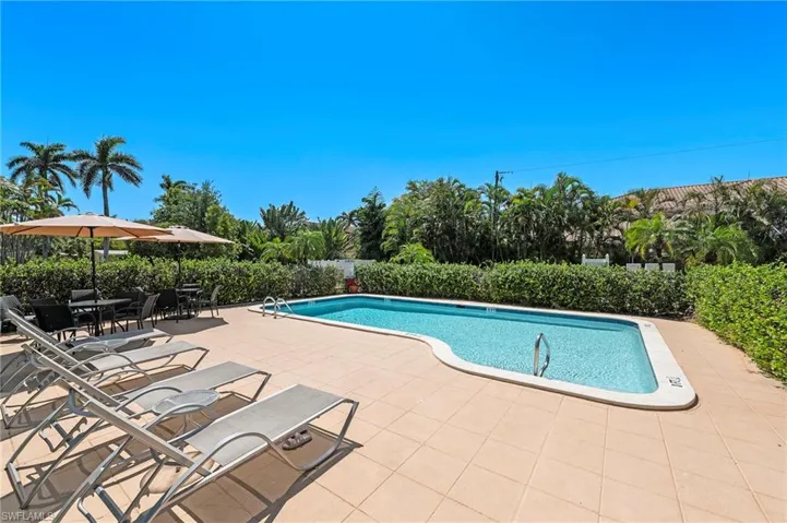 View of swimming pool featuring a fenced in pool and a patio