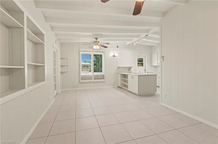 living room facing kitchen and dining area