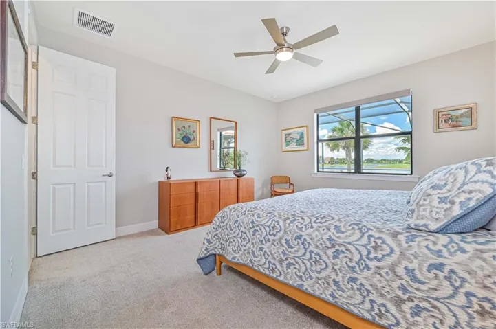 Bedroom featuring ceiling fan and carpet floors