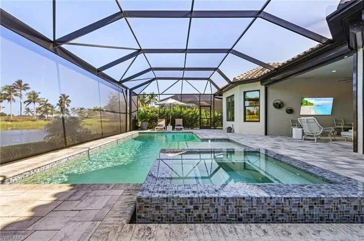 Extended lanai with pool and zero edge spa