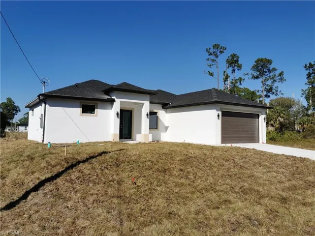View of side of home featuring stucco