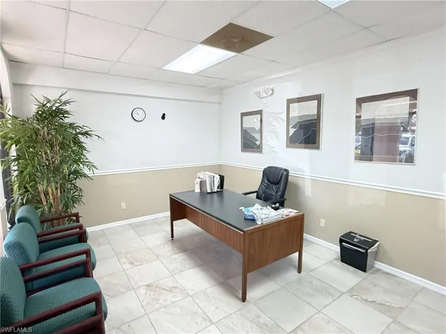 Office reception area featuring chair rail and base molding