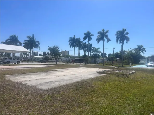 View of home's community with concrete driveway