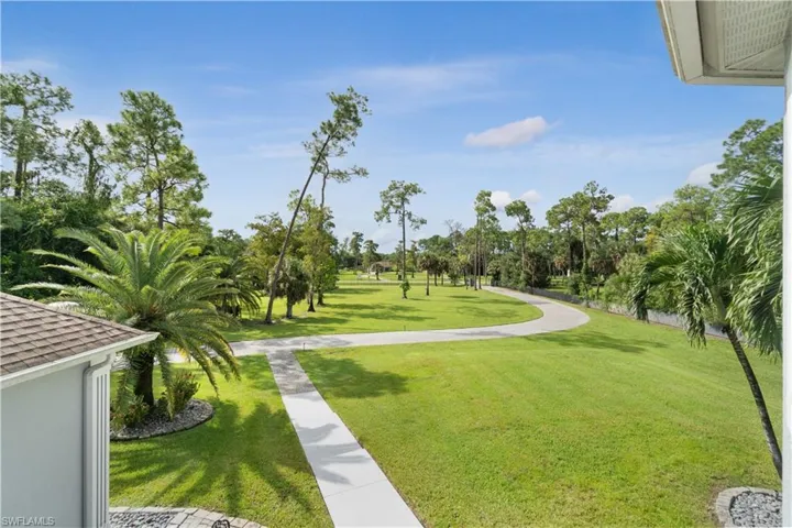 View of property's community featuring a yard
