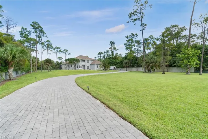 Surrounding community featuring fence and a lawn