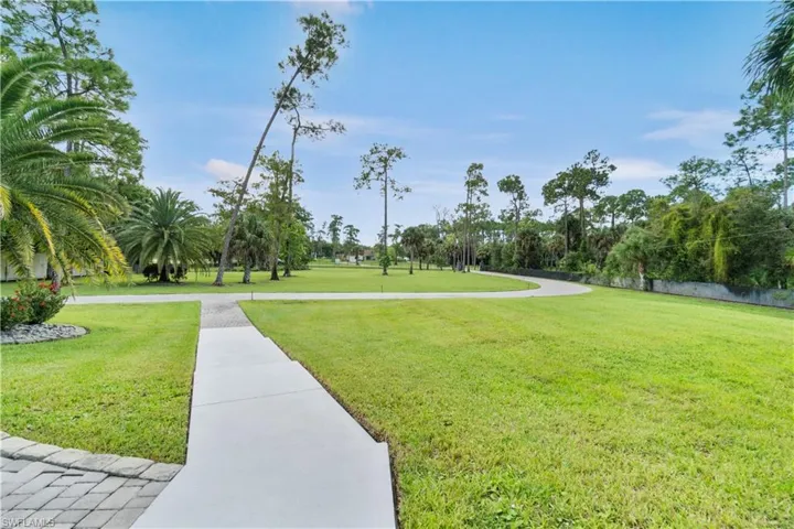 View of community featuring a lawn