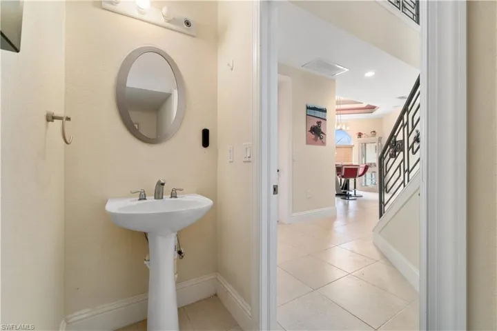 Bathroom with recessed lighting, visible vents, baseboards, and tile patterned floors