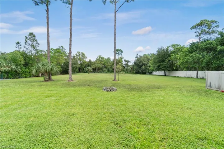 View of yard featuring fence
