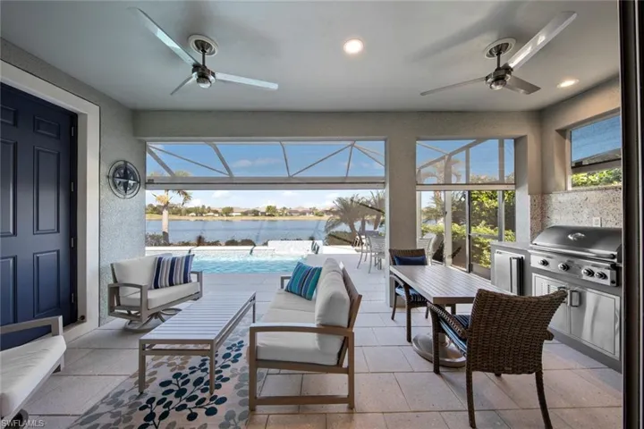 Storm Smart Kevlar ELECTRIC HURRICANE SCREENS (September 2021) located around the entire lanai to protect the furniture and outdoor kitchen.