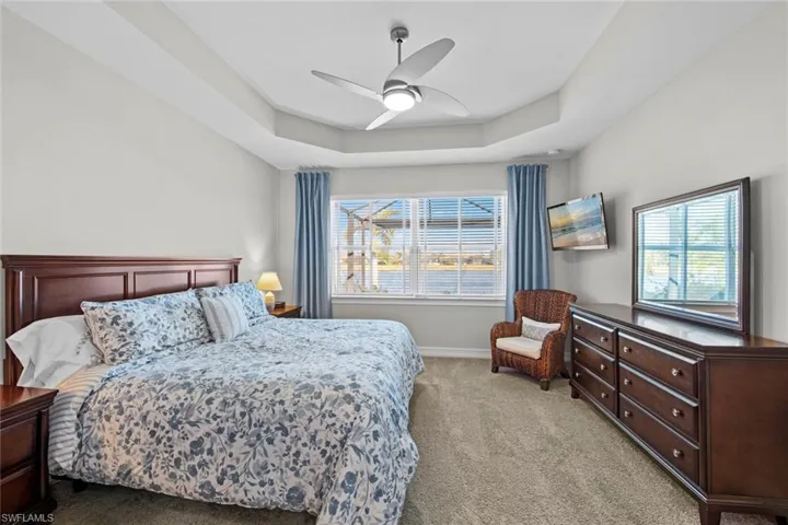Mounted flat screen TV (November 2018) and floor to ceiling linen curtains (September 2021).