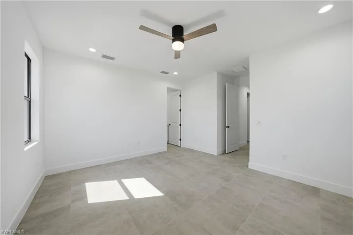 Unfurnished bedroom with a ceiling fan and recessed lighting