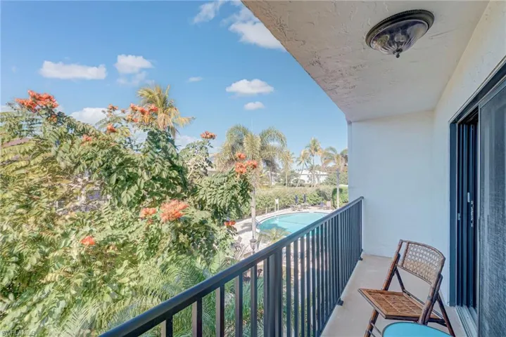 Balcony with view of pool