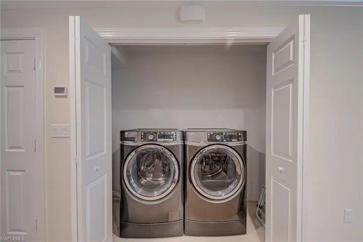 Laundry area featuring independent washer and dryer