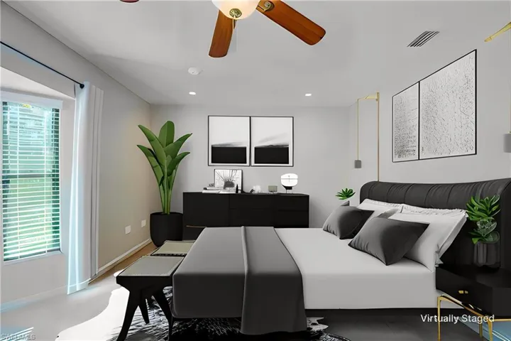 Virtually staging of this to show a different style and placement! Bedroom featuring recessed lighting and ceiling fan- lots of light with the windows