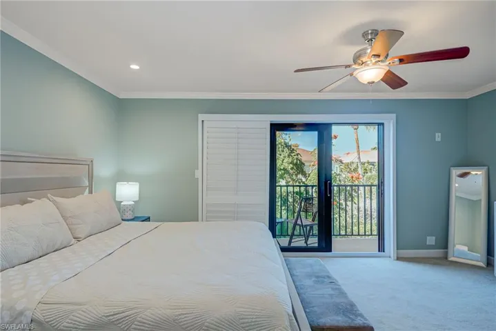 Large Primary Suite! Bedroom with crown molding, light colored carpet, a ceiling fan, access to exterior, and recessed lighting
