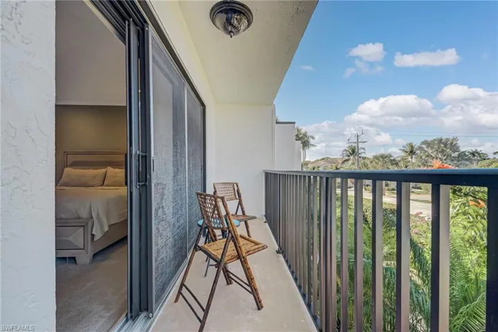 View of balcony off of primary bedroom - perfect for sunsets!