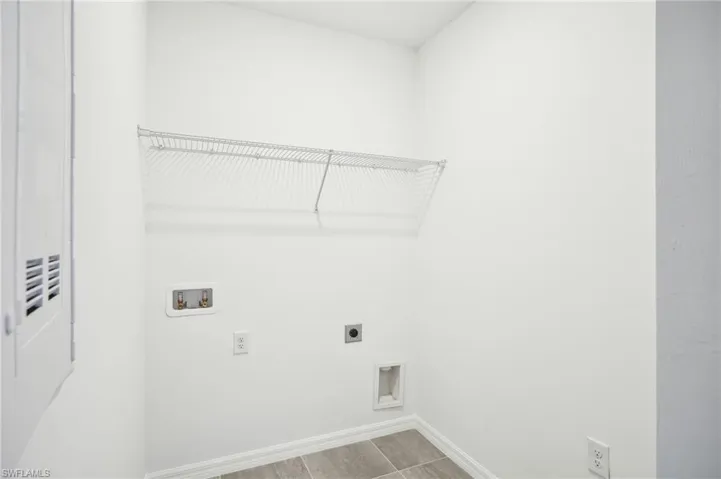 Washroom featuring washer hookup and electric dryer hookup