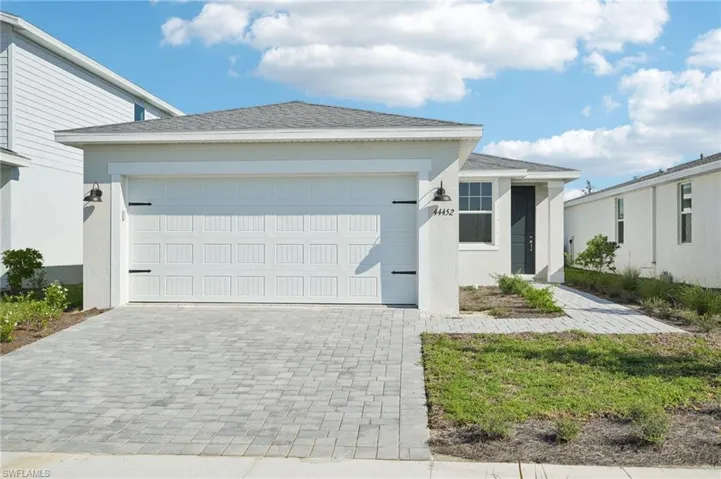 View of front of home featuring a garage