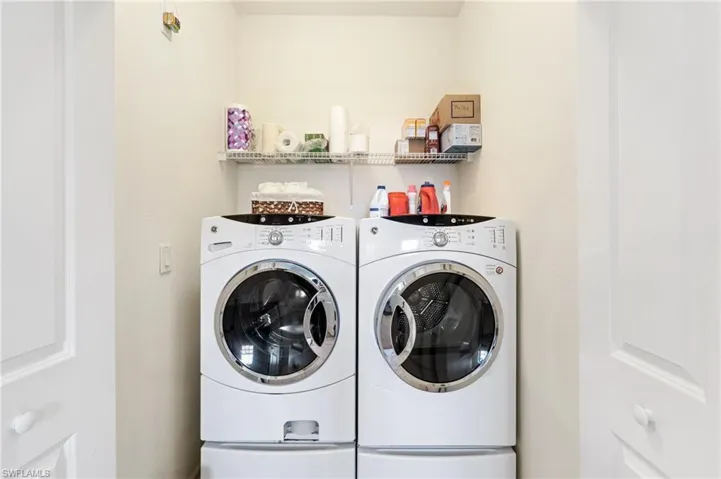 Washroom featuring independent washer and dryer