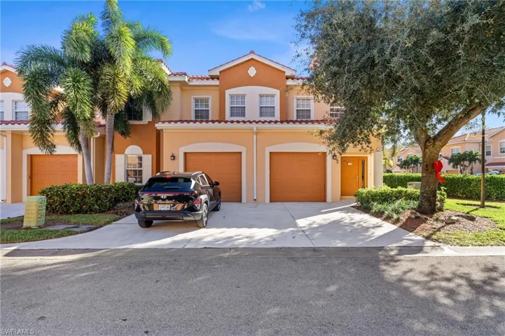 Mediterranean / spanish-style house featuring a garage