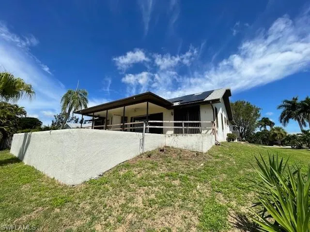 Back of house with an exterior structure