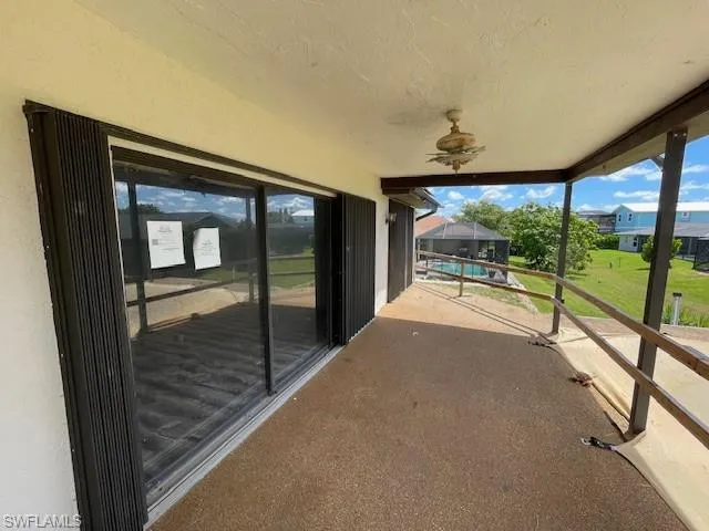 Patio / terrace featuring a ceiling fan and an outdoor pool