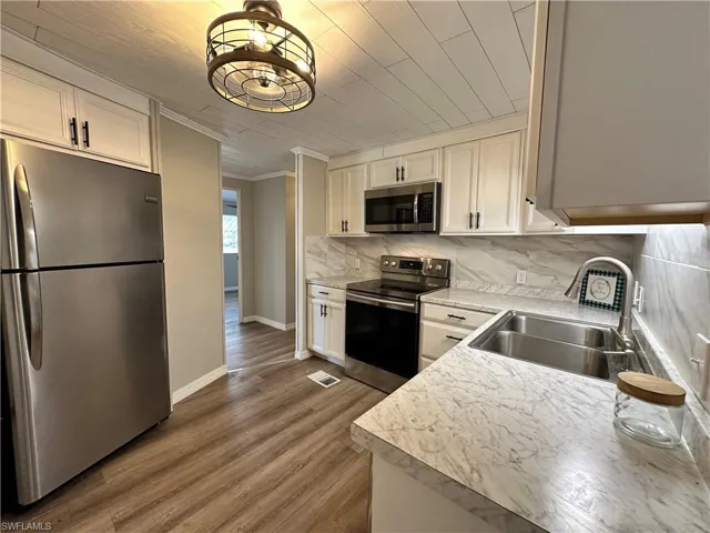 Kitchen with entry from Carport/Lanai