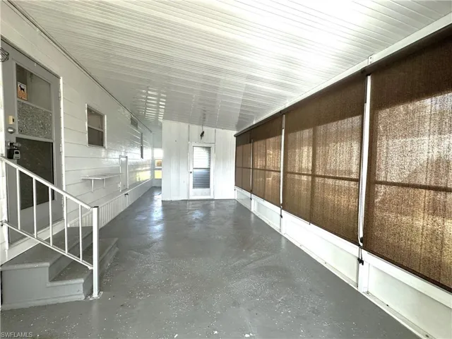 Enclosed patio off of carport