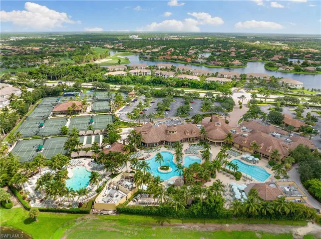 Birds eye view of property with a water view