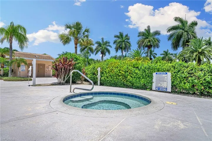 View of pool featuring a hot tub
