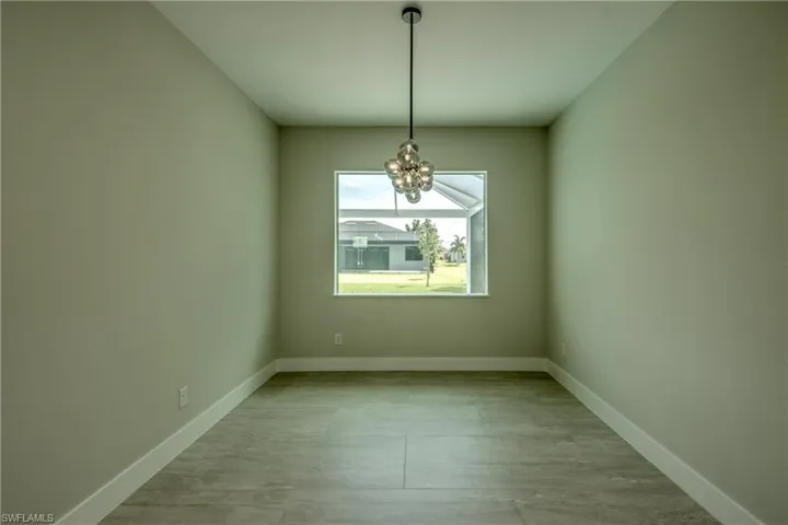 Spare room featuring an inviting chandelier