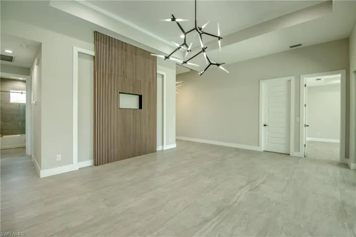 Empty room featuring a notable chandelier