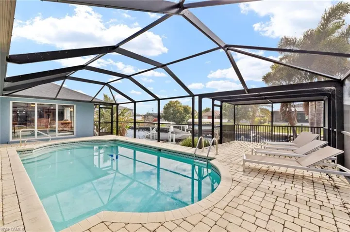 View of pool featuring a lanai and a patio