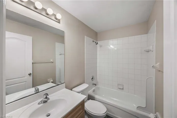 Full bath featuring bathing tub / shower combination and vanity