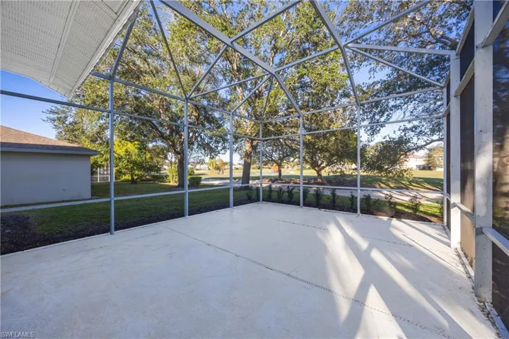 Unfurnished sunroom featuring a patio