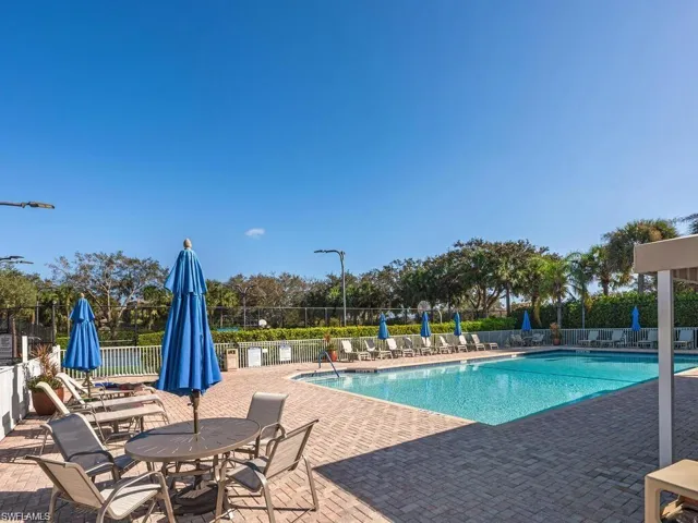 Community pool with a patio