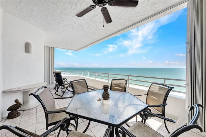 Balcony featuring a view of the beach