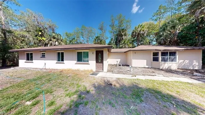 Ranch-style home with a front yard