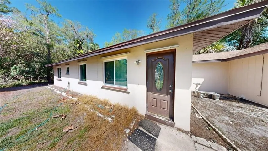 Property entrance with stucco siding