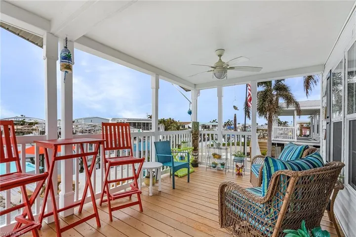 Wooden deck featuring ceiling fan