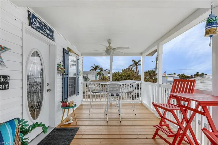 Deck with ceiling fan and covered porch