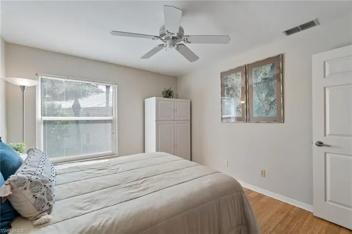Bedroom featuring light wood finished floors and a ceiling fan